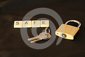 Padlock and key and the word 'SAFE'