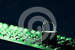 Padlock on keyboard against computer motherboard background. Internet data privacy information security concept. Toned image