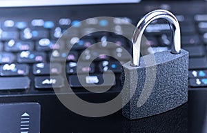 Padlock on laptop computer keyboard