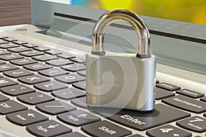 Padlock on the laptop keyboard, 3D rendering
