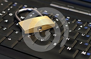 Padlock on laptop - IT security and encryption