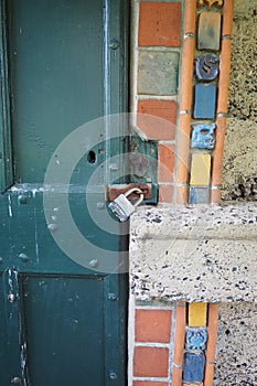 The padlock is on the old storage house door.