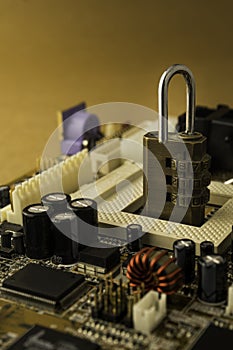 Padlock on PC Mainboard symbolizing Computer Cyber Security .