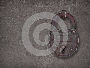 Padlock on a rusty steel plate