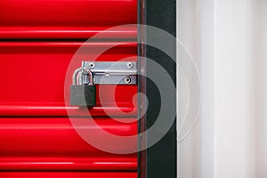 Padlock of self storage door with red door