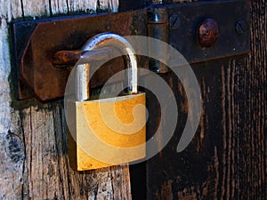 Padlock on wooden door