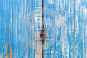 Padlocked on blue wall background