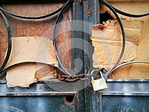 Padlocked chained carton iron door