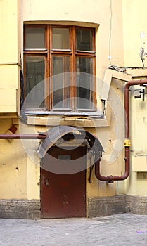 Padlocked entrance to the building with metal door