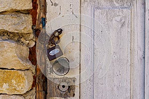 Padlocked old vintage retro rustic wooden door. Background with copy space