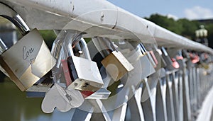 Padlocks attached to a railing as a symbol of the togetherness of two people