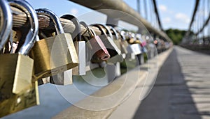 Padlocks attached to a railing as a symbol of the togetherness of two people