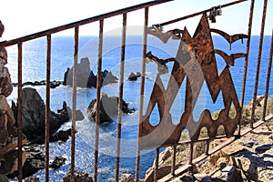 Padlocks hanging on Reef of the Sirens railing in Cabo de Gata