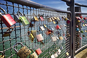 Padlocks in harbor of Konstanz city with a view to lake Constance. Konstanz is a city located in the south-west corner of Germany