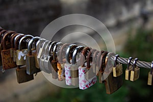 Padlocks, love lock on a bridge sign of connection