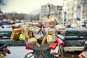 Padlocks tied on a bridge as a symbol of eternal love in an Amsterdam channel