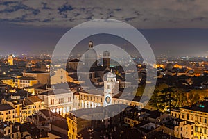 Padova city from above, night aerial view towards the cathedral and mountains