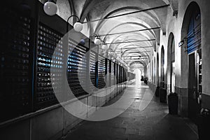 Padova piazza della frutta black and white arcade selective color blue light closed shops photo