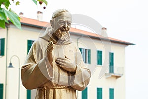 Padre Pio & x28;Father Pio& x29; golden statue, in the act of blessing. photo