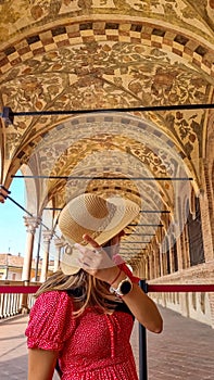 Padua -  Tourist woman with hat in the patio of Palazzo della Ragione in Padua, Veneto, Italy