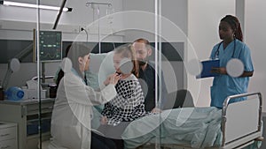 Paediatric doctor examining chest listening heartbeat using medical stethoscope