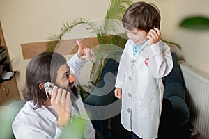 Paediatrician doctor examining a child in comfortabe medical office