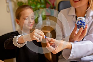 Paediatrician doctor examining a child in comfortabe medical office