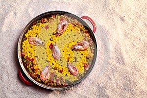 Paella over the sand of the beach