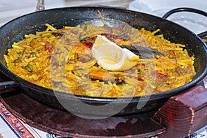 Paella with seafood and saffron rice.