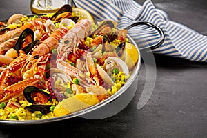 Paella Valencia with fresh langoustines photo