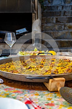 Paellera with a freshly cooked authentic Valencian paella photo