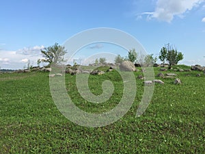 Pagan temple on the Luga river summer sky photo