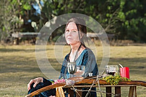 Pagan Woman Sitting Outdoors