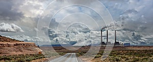 Page Arizona power plant. Long winding highway in the American desert, blue sky with cloud