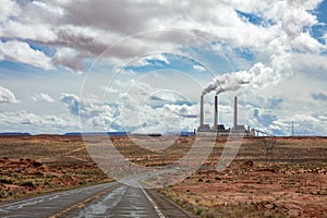 Page Arizona power plant. Long winding highway in the american desert, blue sky with clouds