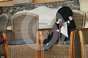 Page boy hiding photo