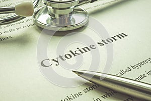 Page about cytokine storm, stethoscope and pen. photo