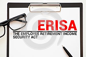 Page with ERISA The Employee Retirement Income Security Act of 1974 on a table