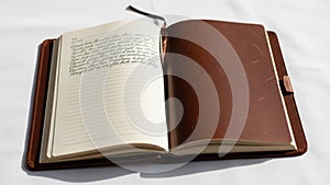 Page is filled with handwritten cursive while the right page