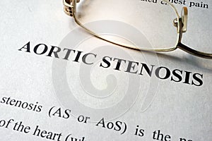 Page with title aortic stenosis and glasses. photo