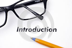 Page with word Introduction with glasses and pen photo