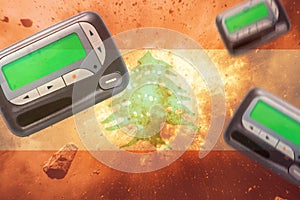 pagers explosions on the background of the flag of Lebanon