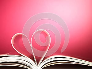 Pages of a book curved into a heart shape