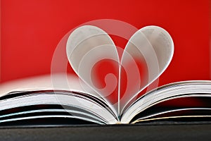 Pages of a book curved into a heart shape photo