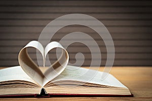 Pages of book curved heart shape