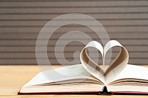 Pages of book curved heart shape