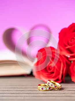 Pages of book curved heart shape with wedding ring