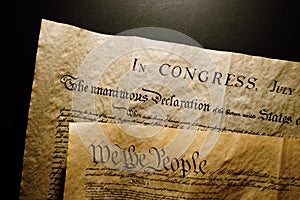 Pages of the United States Constitution showing We The People heading and Declaration of Independence