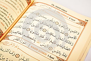 Pages verses from the holy book of islam religion quran, kuran and chapters, surah tin from the Quran photo