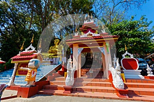 pagoda and Buddha statues in Wat Prathat Doi Wao